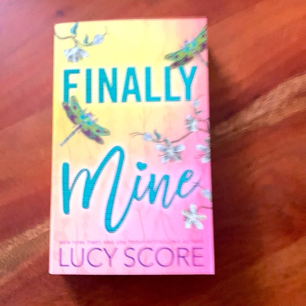 Paperback romance novel “Finally Mine” by Lucy Score